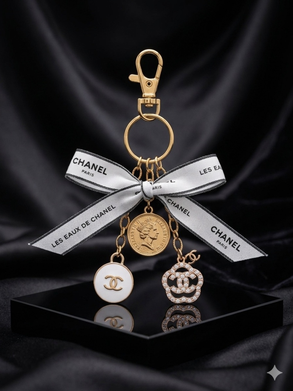 ChaneI Gold-Tone Keyring with White Ribbon and Black Logo and Gold Charms - Picture 3 of 10